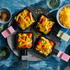 Rezept für Curry-Hähnchen-Raclette mit Tomaten - so wird's würzig an Weihnachten