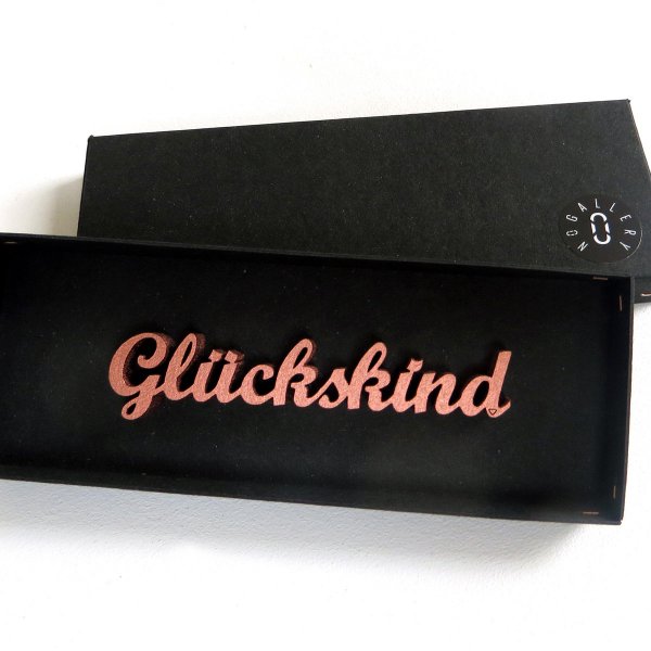 Schriftzug "Glückskind" aus Kupfer von design3000.de